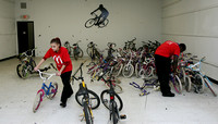 McDonald's employees help repair bikes at The Bike Exchange in Ewing to benefit he Boys and Girls Club of Trenton on Tuesday, December 13, 2011