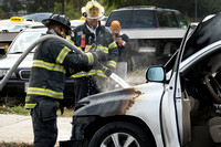 Trenton firefighters extinguish a car fire on S. Broad St. at Fu