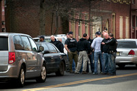 Police raid on 100 block of  Perry St. nets 10 arrests