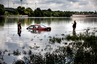Woman rescued from car in river
