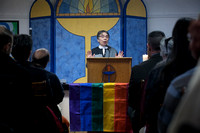 Church dedicates replacement for stolen gay pride flag