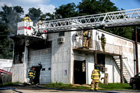 Truck fire spreads to building in Mansfield