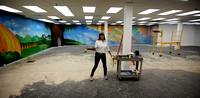 Muralist Nichole Blackburn is painting a mural in the Trenton library's new children's room