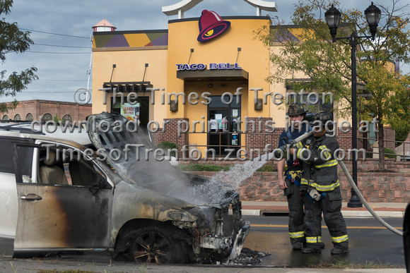 Trenton firefighters extinguish a car fire on S. Broad St. at Fu